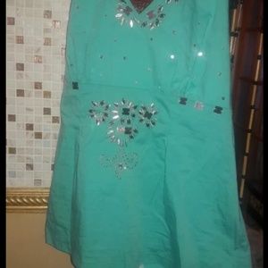 Woman turquoise top with tie on neck